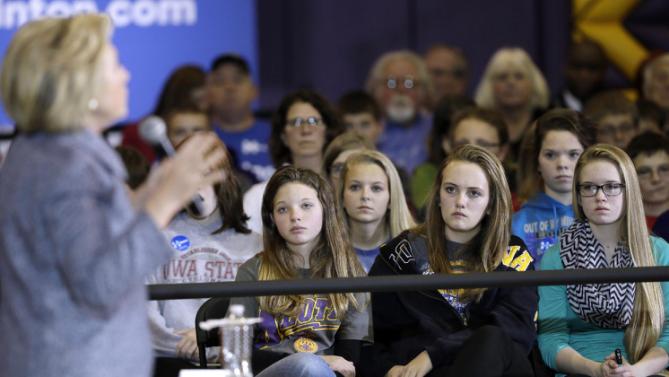 Students listen as Democratic presidential candidate Hillary Clinton speaks during a town hall meeting at Keota High School, Tuesday, Dec. 22, 2015, in Keota, Iowa. (AP Photo/Charlie Neibergall)