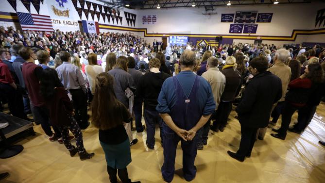 Audience members listen as Democratic presidential candidate Hillary Clinton speaks during a town hall meeting at Keota High School, Tuesday, Dec. 22, 2015, in Keota, Iowa. (AP Photo/Charlie Neibergall)
