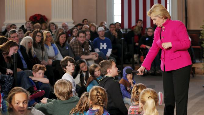 U.S. Democratic presidential candidate Hillary Clinton takes a question from young audience member at a campaign town hall meeting at South Church in Portsmouth, New Hampshire, December 29, 2015. REUTERS/Brian Snyder