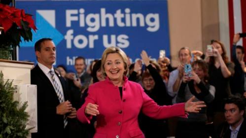 Democratic presidential candidate Hillary Clinton, center, smiles as she arrives at a campaign event Tuesday, Dec. 29, 2015, at South Church, in Portsmouth, N.H. (AP Photo/Steven Senne)