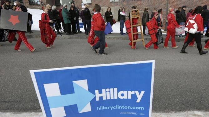 Members of the International Red Star Twirlers, from Derry, N.H., arrive at a campaign event for Democratic presidential candidate Hillary Clinton, Sunday, Jan. 3, 2016, in Derry. (AP Photo/Steven Senne)