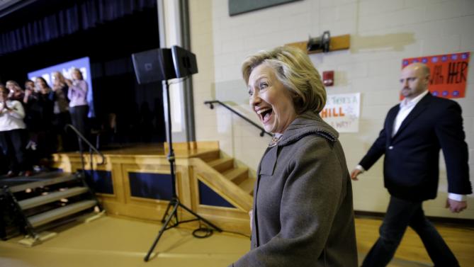 Democratic presidential candidate Hillary Clinton smiles as she greets people in the audience as she arrives at a town hall style campaign event Sunday, Jan. 3, 2016, in Derry, N.H. (AP Photo/Steven Senne)