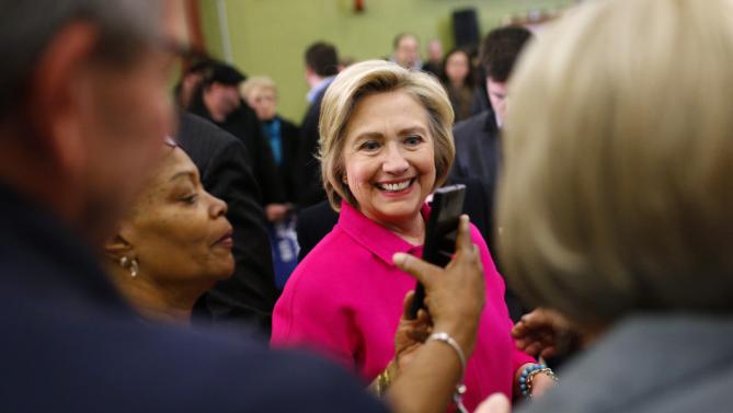 Democratic presidential candidate Hillary Clinton prepares to pose for a selfie as she greets supporters after a town hall at NewBo City Market in Cedar Rapids, Iowa, Monday, Jan. 4, 2016. (AP Photo/Patrick Semansky)