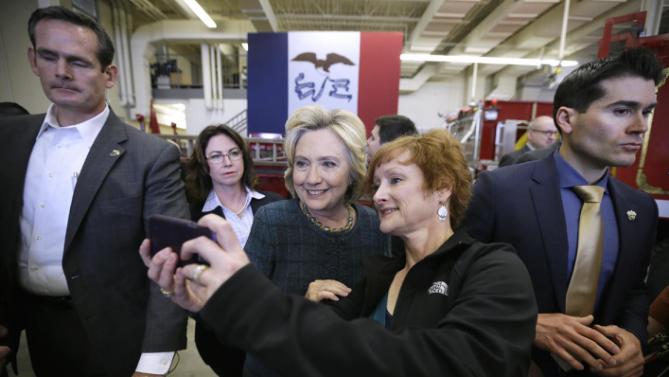 Democratic presidential candidate Hillary Clinton poses for a photo with Cynthia Johnson of Osage, Iowa, during a campaign stop at the Osage Public Safety Center, Tuesday, Jan. 5, 2016, in Osage, Iowa. (AP Photo/Charlie Neibergall)