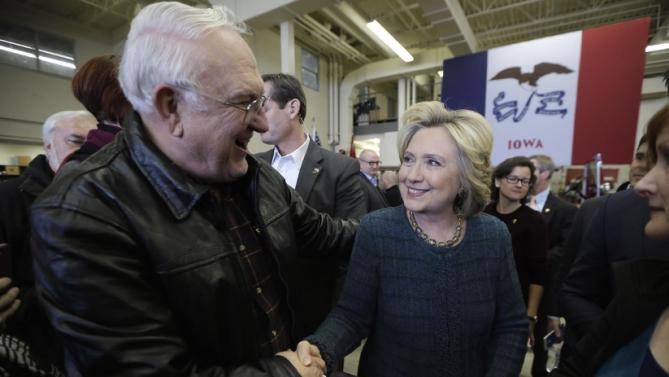 Democratic presidential candidate Hillary Clinton talks with Paul Bodtke of Osage, Iowa during a campaign stop at the Osage Public Safety Center, Tuesday, Jan. 5, 2016, in Osage, Iowa. (AP Photo/Charlie Neibergall)