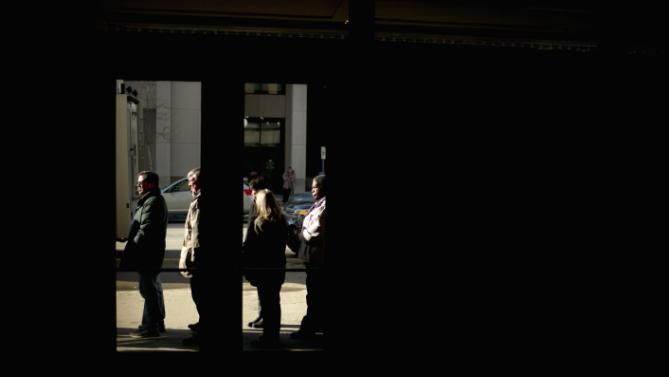 Supporters of Democratic presidential candidate Hillary Clinton wait in line outside Orpheum Theatre in Sioux City, Iowa, Tuesday, Jan. 5, 2016, to attend a rally. (AP Photo/Jae C. Hong)