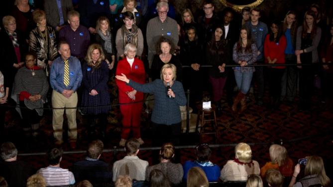 Democratic presidential candidate Hillary Clinton, center, addresses supporters during a rally at the Orpheum Theatre, Tuesday, Jan. 5, 2016, in Sioux City, Iowa. (AP Photo/Jae C. Hong)
