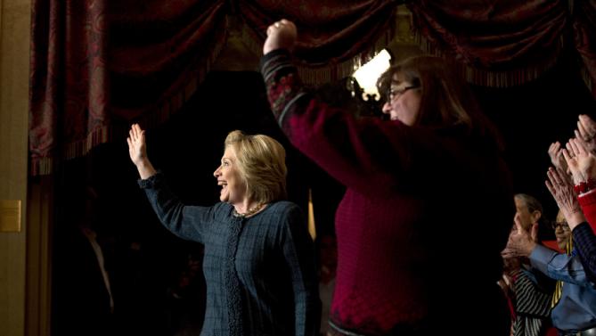 Democratic presidential candidate Hillary Clinton, left, waves as she is introduced at a rally at the Orpheum Theatre, Tuesday, Jan. 5, 2016, in Sioux City, Iowa. (AP Photo/Jae C. Hong)
