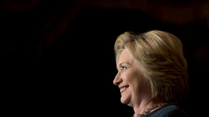 Democratic presidential candidate Hillary Clinton smiles while speaking at a rally at the Orpheum Theatre, Tuesday, Jan. 5, 2016, in Sioux City, Iowa. (AP Photo/Jae C. Hong)