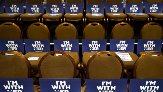 Signs for supporters of Democratic presidential candidate Hillary Clinton are displayed at a Democratic fundraising dinner featuring all three candidates in Las Vegas, Nevada, January 6, 2016.  Martin O'Malley and Bernie Sanders were also expected to attend.  REUTERS/Rick Wilking