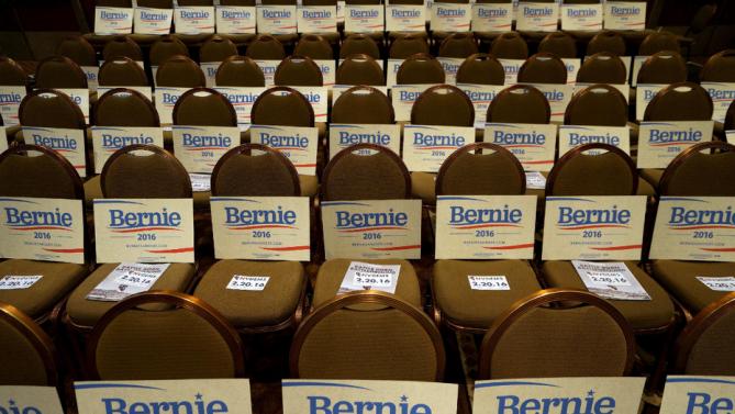 Signs for supporters of Democratic presidential candidate Bernie Sanders are diplayed at a Democratic fundraising dinner featuring all three candidates in Las Vegas, Nevada, January 6, 2016.  Martin O'Malley and Hillary Clinton were also expected to attend.  REUTERS/Rick Wilking
