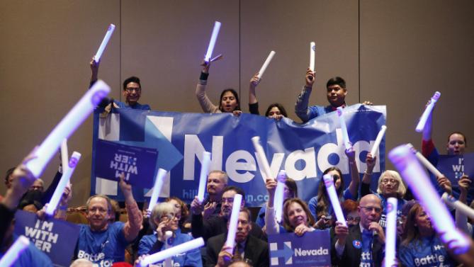 Supporters of Democratic presidential candidate Hillary Clinton cheer during the Battle Born Battleground First in the West Caucus Dinner, Wednesday, Jan. 6, 2016, in Las Vegas. (AP Photo/John Locher)