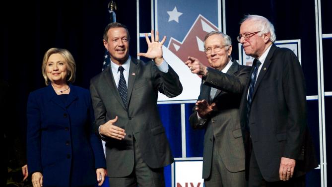 Democratic presidential candidates pose on stage before a fundraiser in Las Vegas, Nevada January 6, 2016.  Left to right are Hillary Clinton, Martin O'Malley, Senator Harry Reid (D-NV) and Bernie Sanders. REUTERS/Rick Wilking      TPX IMAGES OF THE DAY