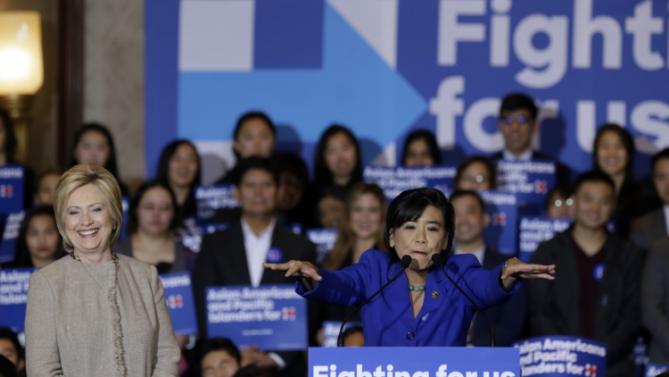 Democratic presidential candidate Hillary Clinton, left, is welcomed by Rep. Judy Chu, D-Calif., before addressing Asian American and Pacific Islander supporters in San Gabriel, Calif., Thursday, Jan. 7, 2016. (AP Photo/Damian Dovarganes)