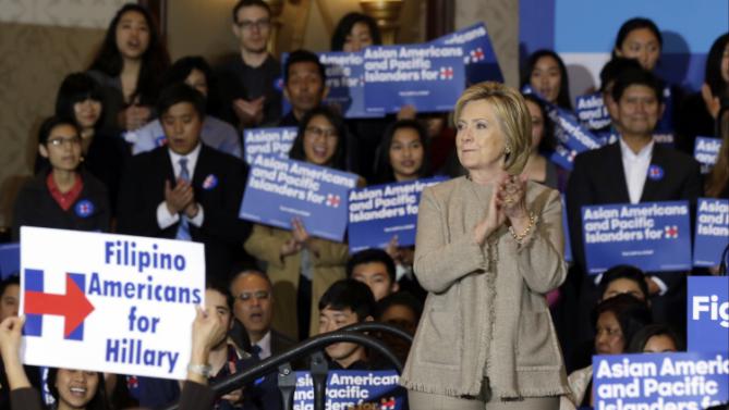 Democratic presidential candidate Hillary Clinton is welcomed by Asian American and Pacific Islander supporters in San Gabriel, Calif., on Thursday, Jan. 7, 2016. (AP Photo/Damian Dovarganes)