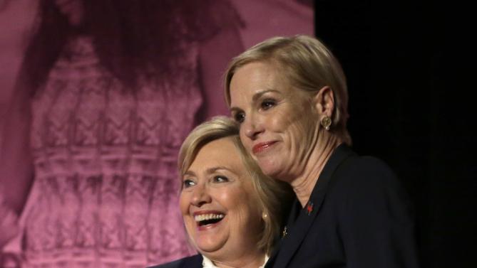 Democratic presidential candidate Hillary Clinton, left, stands with Cecile Richards, Planned Parenthood's president, right, during an event Sunday, Jan. 10, 2016, in Hooksett, N.H., during which Planned Parenthood endorsed Clinton in the presidential race. The endorsement by the group's political arm marks Planned Parenthood's first time wading into a presidential primary. (AP Photo/Steven Senne)