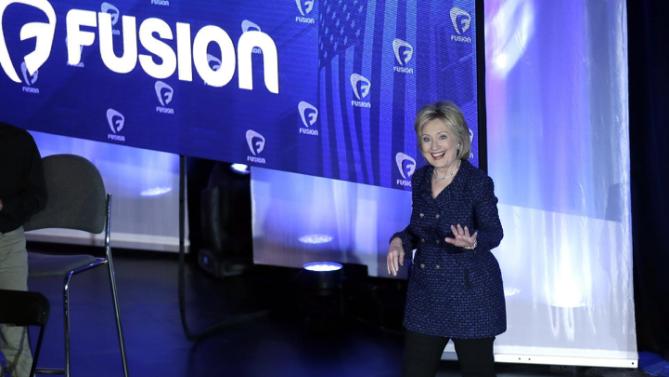Democratic presidential candidate, Hillary Clinton waves as she appears at the Brown & Black Forum, Monday, Jan. 11, 2016, in Des Moines, Iowa. (AP Photo/Charlie Neibergall)