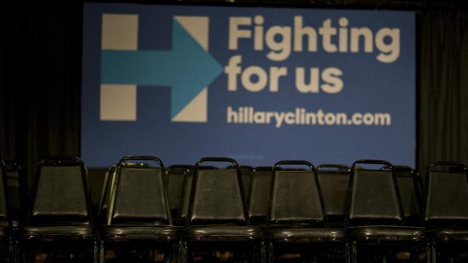 Chairs are placed behind the podium at a rally with Democratic presidential candidate Hillary Clinton Monday, Jan. 11, 2016, in Waterloo, Iowa. (AP Photo/Jae C. Hong)