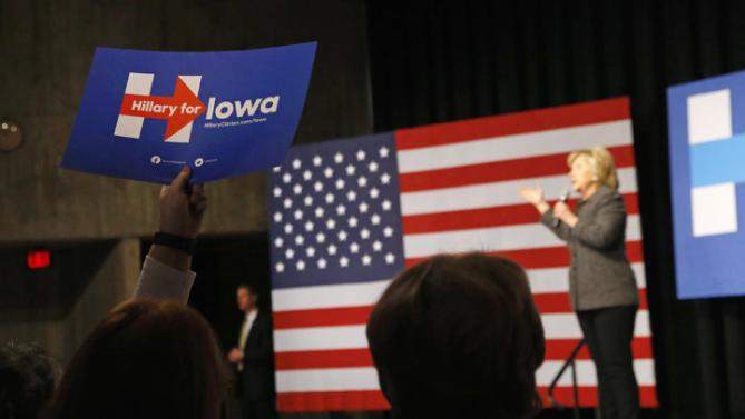 A supporter holds up a sign as Democratic presidential candidate Hillary Clinton speaks during a campaign event at Iowa State University in Ames, Iowa, Tuesday, Jan. 12, 2016. (AP Photo/Patrick Semansky)