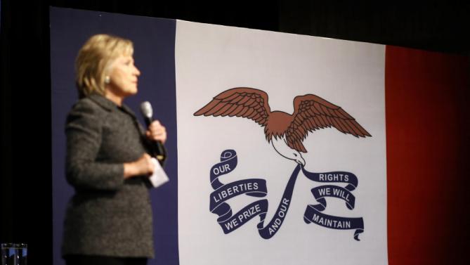 The Iowa state flag is seen at right as Democratic presidential candidate Hillary Clinton speaks during a campaign event at Iowa State University in Ames, Iowa, Tuesday, Jan. 12, 2016. (AP Photo/Patrick Semansky)