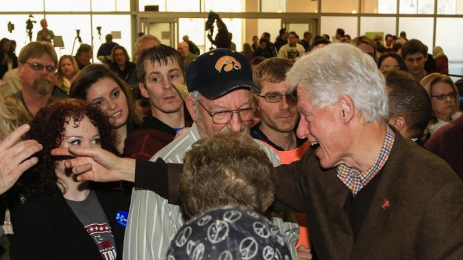 Former President Bill Clinton meets with members of his audience after speaking at a campaign event for his wife, Democratic presidential candidate Hillary Clinton,  Friday, Jan. 15, 2016, at Morningside College in Sioux City, Iowa. (AP Photo/Nati Harnik)