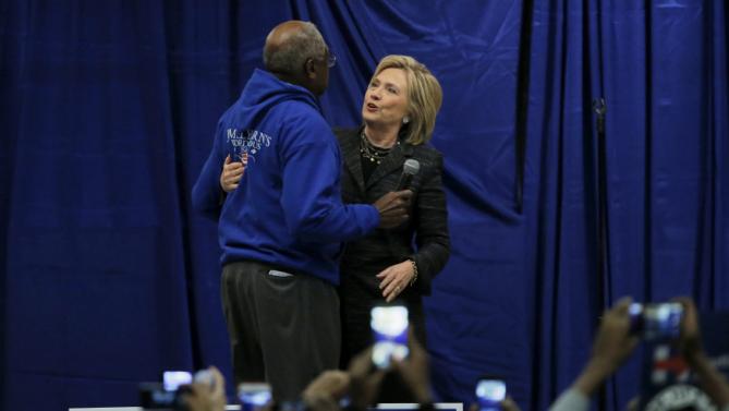 U.S. Democratic presidential candidate Hillary Clinton shares a hug with U.S. Representative Jim Clyburn on stage during Jim Clyburn’s Annual Fish Fry in Charleston, South Carolina January 16, 2016. REUTERS/Chris Keane