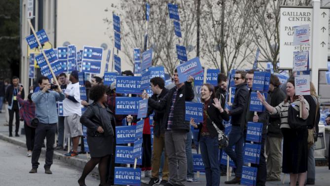 Bernie Sanders supporters stand next to Hillary Clinton supporters outside the Gaillard Center before the start of the NBC News-YouTube Democratic Debate in Charleston, South Carolina, January 17, 2016. REUTERS/Randall Hill