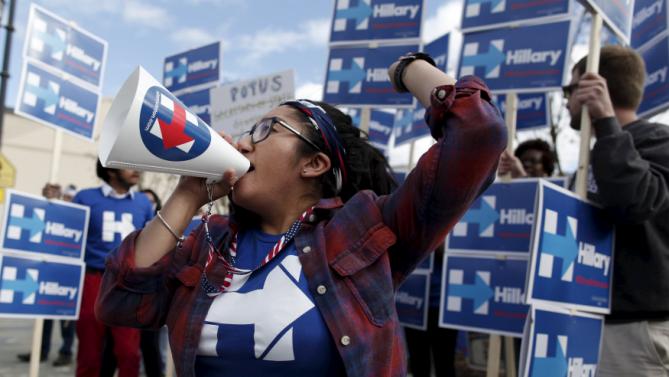 Silvia Alarcon, a staffer for the Hillary Clinton campaign leads supporters outside the Gaillard Center before the start of the NBC News-YouTube Democratic Debate in Charleston, South Carolina, January 17, 2016. REUTERS/Randall Hill