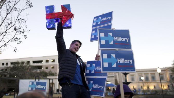 A supporter chants for Democratic presidential candidate Hillary Clinton during a rally outside the Gaillard Center where the Democratic debate is set to be held Sunday, Jan. 17, 2016, in Charleston, S.C. (AP Photo/Stephen B. Morton)