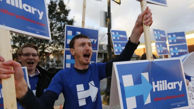 Josh McCafferty of New Jersey, cheers for Democratic presidential candidate, Hillary Clinton before the start of the NBC, YouTube Democratic presidential debate at the Gaillard Center, Sunday, Jan. 17, 2016 in Charleston, SC. (AP Photo/Mic Smith)