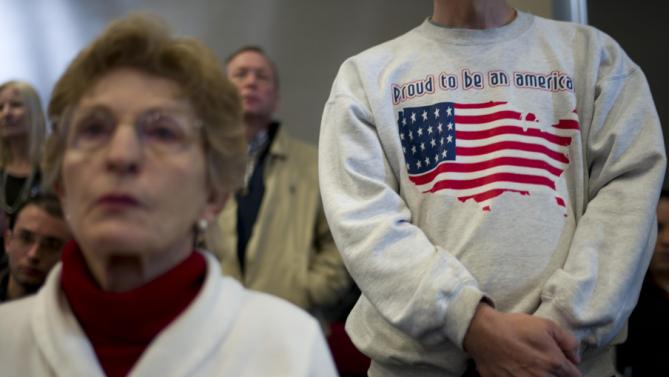 Supporters listen to Democratic presidential candidate Hillary Clinton during a rally Thursday, Jan. 21, 2016, in Vinton, Iowa. (AP Photo/Jae C. Hong)