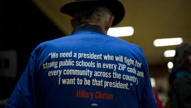 A man wears a t-shirt supporting Democratic presidential candidate Hillary Clinton during a rally Thursday, Jan. 21, 2016, in Vinton, Iowa. (AP Photo/Jae C. Hong)