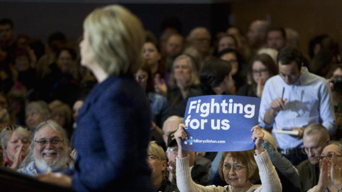 A supporter holds up a sign while listening to Democratic presidential candidate Hillary Clinton speak during a rally on the campus of Simpson College, Thursday, Jan. 21, 2016, in Indianola, Iowa. (AP Photo/Jae C. Hong)