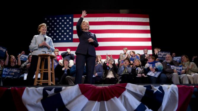 Democratic presidential candidate Hillary Clinton, center, accompanied by Sen. Jeanne Shaheen, D-N.H., gestures during a campaign stop Friday, Jan. 22, 2016, in Rochester, N.H. (AP Photo/Matt Rourke)