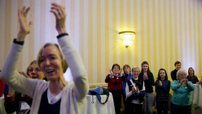 Attendees cheer Democratic presidential candidate Hillary Clinton as she speaks Friday, Jan. 22, 2016, at a NARAL Pro-Choice dinner in Concord, N.H. (AP Photo/Matt Rourke)