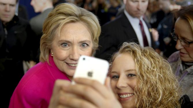 Democratic U.S. presidential candidate Hillary Clinton takes a photo with Hope-Marie Murphy, 27, of Clinton, Iowa, after a Get Out the Caucus event at the Eagle Heights Elementary School in Clinton, Iowa, January 23, 2016. REUTERS/Scott Morgan