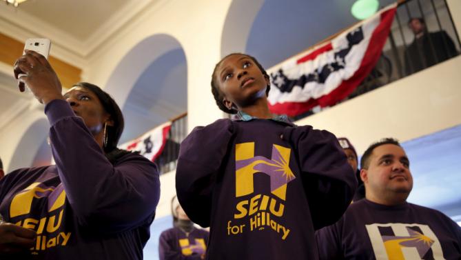 Amari Ogleton, 8, of Milwaukee, Wis., listens as Democratic U.S. presidential candidate Hillary Clinton speaks during the Hard Hats for Hillary event at the Danceland Ballroom in Davenport, Iowa, January 23, 2016. REUTERS/Scott Morgan