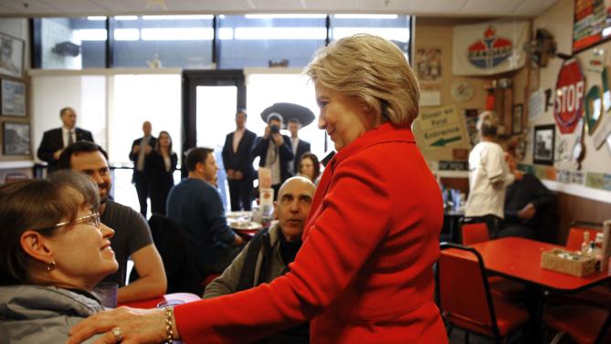 Democratic presidential candidate Hillary Clinton greets diners at Riley's Cafe in Cedar Rapids, Iowa, Sunday, Jan. 24, 2016. (AP Photo/Patrick Semansky)
