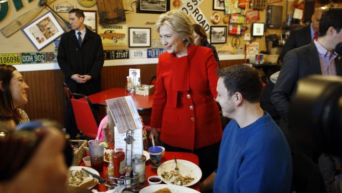 Democratic presidential candidate Hillary Clinton greets diners at Riley's Cafe in Cedar Rapids, Iowa, Sunday, Jan. 24, 2016. (AP Photo/Patrick Semansky)