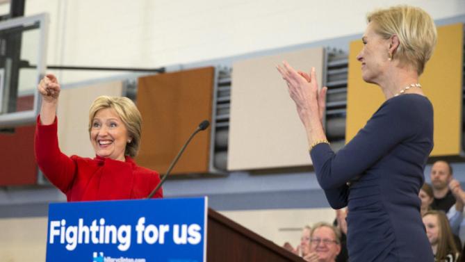 Planned Parenthood president Cecile Richards, right, applauds Democratic presidential candidate Hillary Clinton during a campaign rally at Burford Garner Elementary School, on Sunday, Jan. 24, 2016, in North Liberty, Iowa. (AP Photo/Evan Vucci)