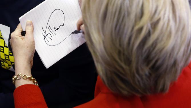 Democratic presidential candidate Hillary Clinton signs an autograph after speaking at Valley Southwoods Freshman High School in West Des Moines, Iowa, Sunday, Jan. 24, 2016. (AP Photo/Patrick Semansky)