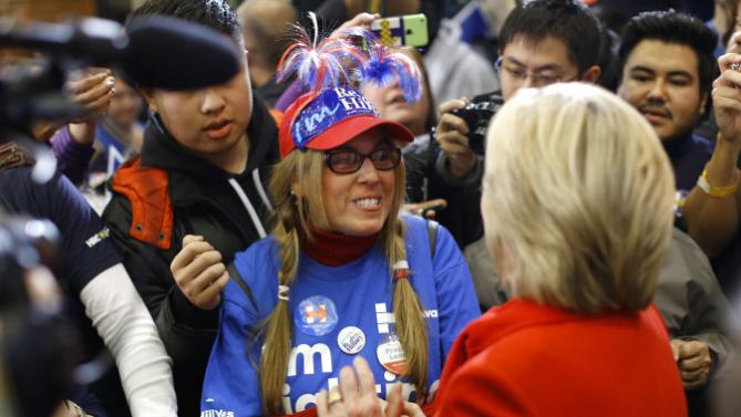 Democratic presidential candidate Hillary Clinton, right, greets a supporter after speaking at Valley Southwoods Freshman High School in West Des Moines, Iowa, Sunday, Jan. 24, 2016. (AP Photo/Patrick Semansky)