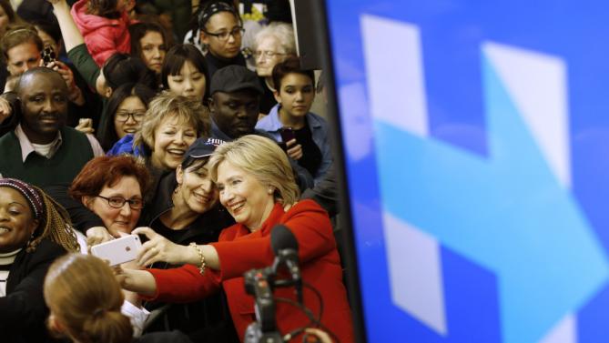 Democratic presidential candidate Hillary Clinton takes a selfie with a supporter after speaking at Valley Southwoods Freshman High School in West Des Moines, Iowa, Sunday, Jan. 24, 2016. (AP Photo/Patrick Semansky)