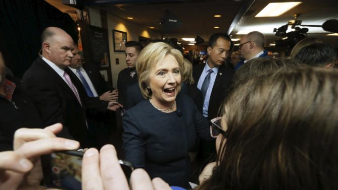 U.S. Democratic presidential candidate Hillary Clinton greets supporters in the crowd during a campaign stop at the Adel Family Fun Center bowling alley in Adel, Iowa January 27, 2016.   REUTERS/Jim Bourg