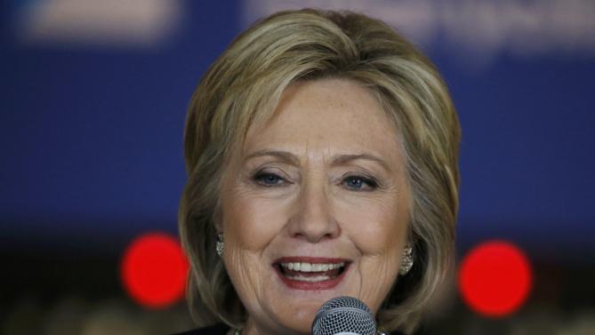 U.S. Democratic presidential candidate Hillary Clinton smiles while speaking at a campaign stop at the Adel Family Fun Center in Adel, Iowa January 27, 2016. REUTERS/Jim Bourg