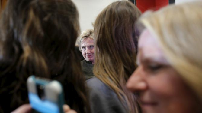 U.S. Democratic presidential candidate Hillary Clinton greets audience members during a campaign stop at the Berg Middle School in Newton, Iowa January 28, 2016. REUTERS/Brian Snyder