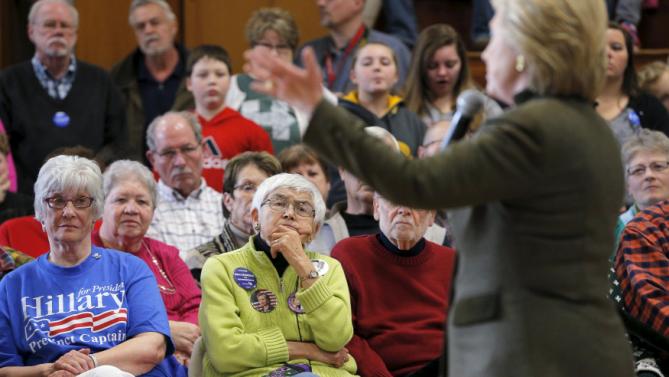 Audience members listen as U.S. Democratic presidential candidate Hillary Clinton speaks during a campaign stop at the Berg Middle School in Newton, Iowa January 28, 2016. REUTERS/Brian Snyder