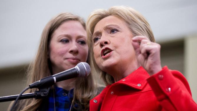 Democratic presidential candidate Hillary Clinton, accompanied by her daughter Chelsea Clinton, speaks at the African American Festival, I'll Make Me a World Celebration Day at the Iowa Events Center in Des Moines, Iowa, Saturday, Jan. 30, 2016. (AP Photo/Andrew Harnik)