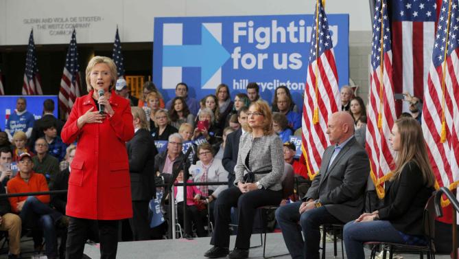 U.S. Democratic presidential candidate Hillary Clinton speaks as her daughter Chelsea Clinton sits with Gabby Giffords and her husband Mark Kelly during a "Get Out to Caucus" rally at Iowa State University in Ames, Iowa January 30, 2016.  The New York Times's editorial board endorsed Democrat Hillary Clinton and Republican John Kasich as they seek to become their parties' nominees in the U.S. presidential election, calling Clinton one of the most "deeply qualified presidential candidates in modern history." REUTERS/Brian Snyder