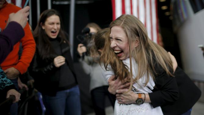 Chelsea Clinton gets a hug from six-year-old Lily Salazar at a campaign rally with U.S. Democratic presidential candidate Hillary Clinton at Iowa State University in Ames, Iowa January 30, 2016.  REUTERS/Brian Snyder